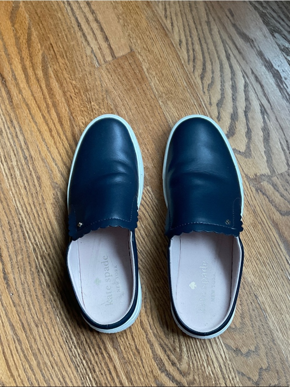 kate spade navy leather slip-on sneakers with cream soles